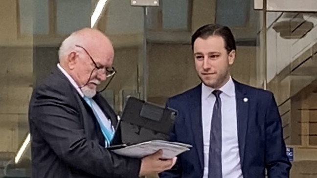 Phillip Navarra (right) and his lawyer (left) outside Liverpool Local Court on Wednesday.