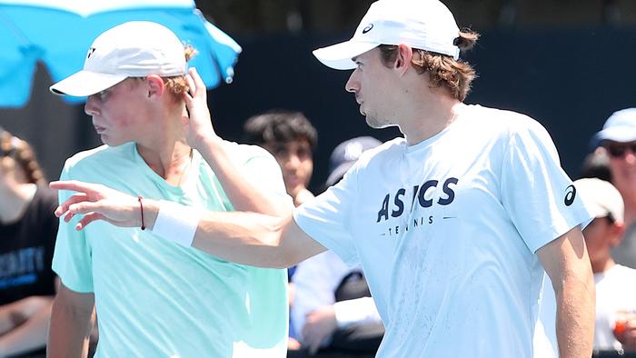 MELBOURNE, AUSTRALIA - JANUARY 09: Alex de Minaur of Australia speaks with Cruz Hewitt during a training session ahead of the 2024 Australian Open at Melbourne Park on January 09, 2024 in Melbourne, Australia. (Photo by Kelly Defina/Getty Images)