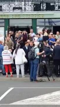 Bystander throws McDonald’s shake at Nigel Farage