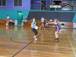 Hurricanes centre Lilly Rayner (with ball) and Doorslammers defender Hannah Luck in club netball on Monday night. Picture: Gerard Walsh