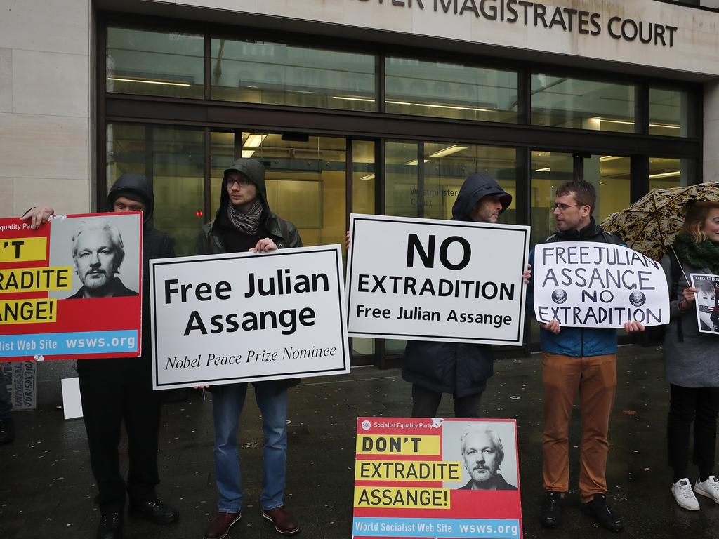 Supporters of WikiLeaks founder Julian Assange protest in front of Westminster Magistrates Court in London. Picture: AP Photo/Frank Augstein