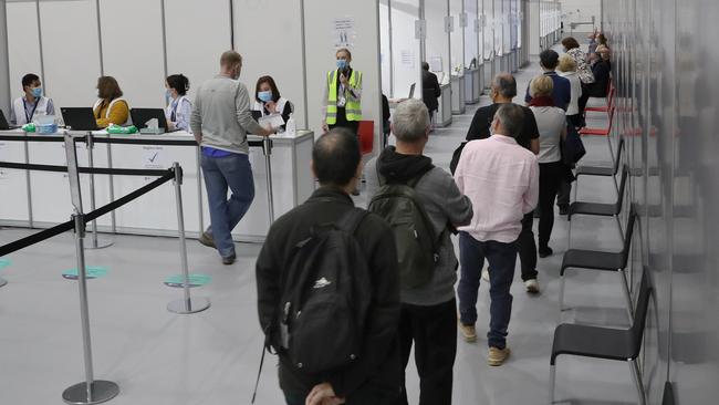 Vaccinations for Over 50s has kicked off across the country. Here people line up to receive their jab at the Melbourne Exhibition Centre. Picture: David Crosling