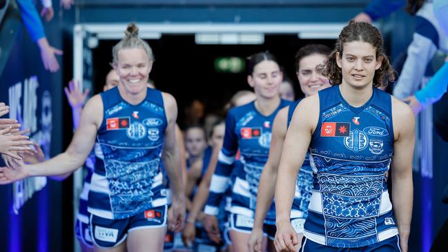 Nina Morrison leads the Cats out in her 50th game earlier this month. Picture: Dylan Burns/AFL Photos via Getty Images