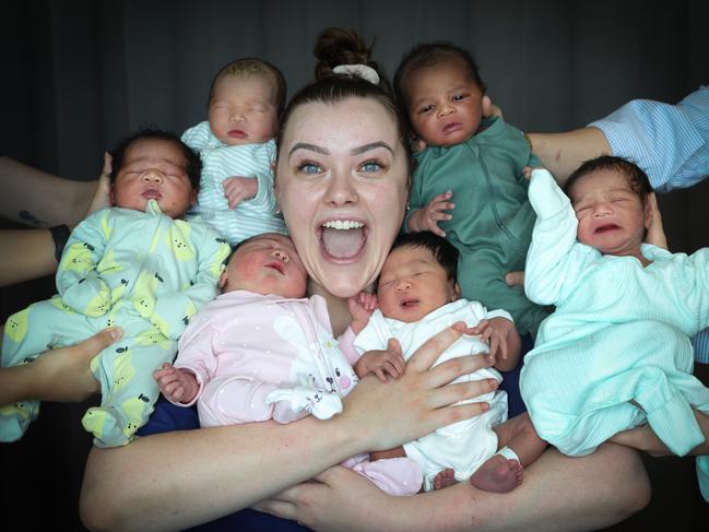 Midwife Olivia Kivlighon with some of the new arrivals at Joan Kirner Women’s and Children’s Hospital. Picture: David Caird