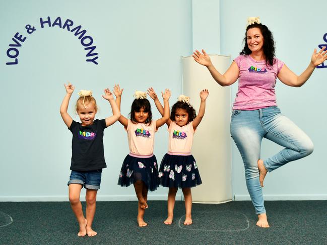 KIDS IN HARMONY; Well Being Educator Kate Martyn with Ella Church 3, Grace and Eliose Davison 4. Picture: Alix Sweeney