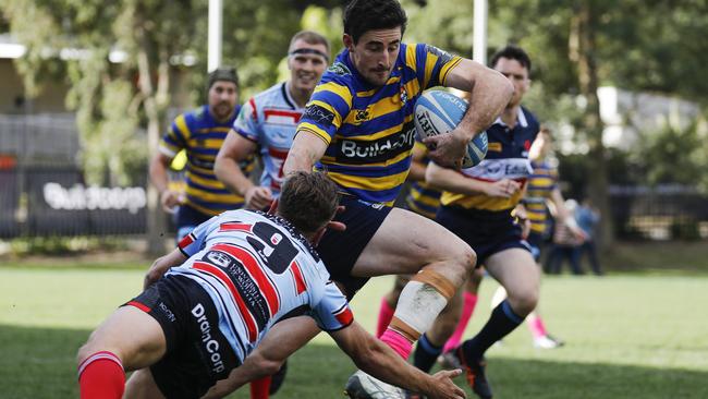 Action in the match between Sydney University and Southern Districts.