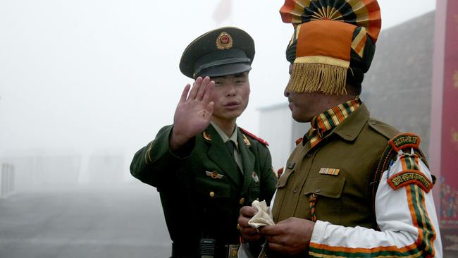 Chinese and Indian soldiers at the Nathu La border crossing. Picture: AFP