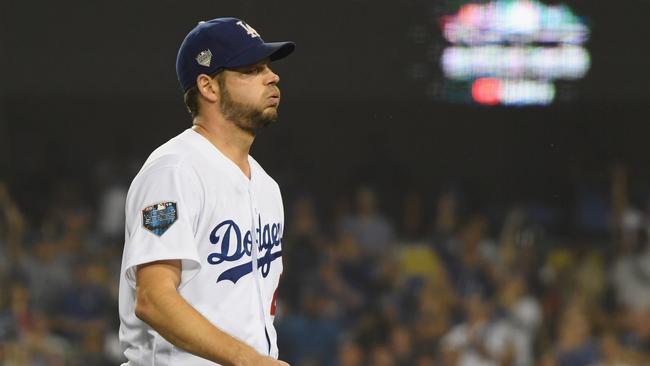 Pitcher Rich Hill looks on as he leaves the game in the seventh inning of Game Four.