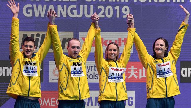 Mitch Larkin, Matthew Wilson, Emma McKeon and Cate Campbell celebrate their success.