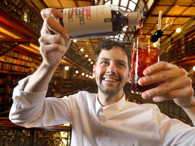 The State Library of South Australia is partnering with craft gin producer Storytellers Distillery to host Storytellers Distillery @ the Mortlock, a first of its kind pop-up gin bar in the Mortlock Chamber. Head distiller Lachlan Gunner preparing for the main event. 2 July 2023. Picture Dean Martin