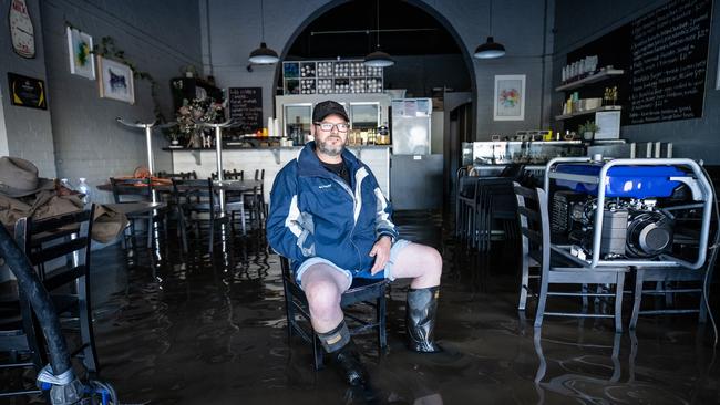 Shayne Walkley inside his Rochester cafe during October’s flood emergency. Picture: Jason Edwards