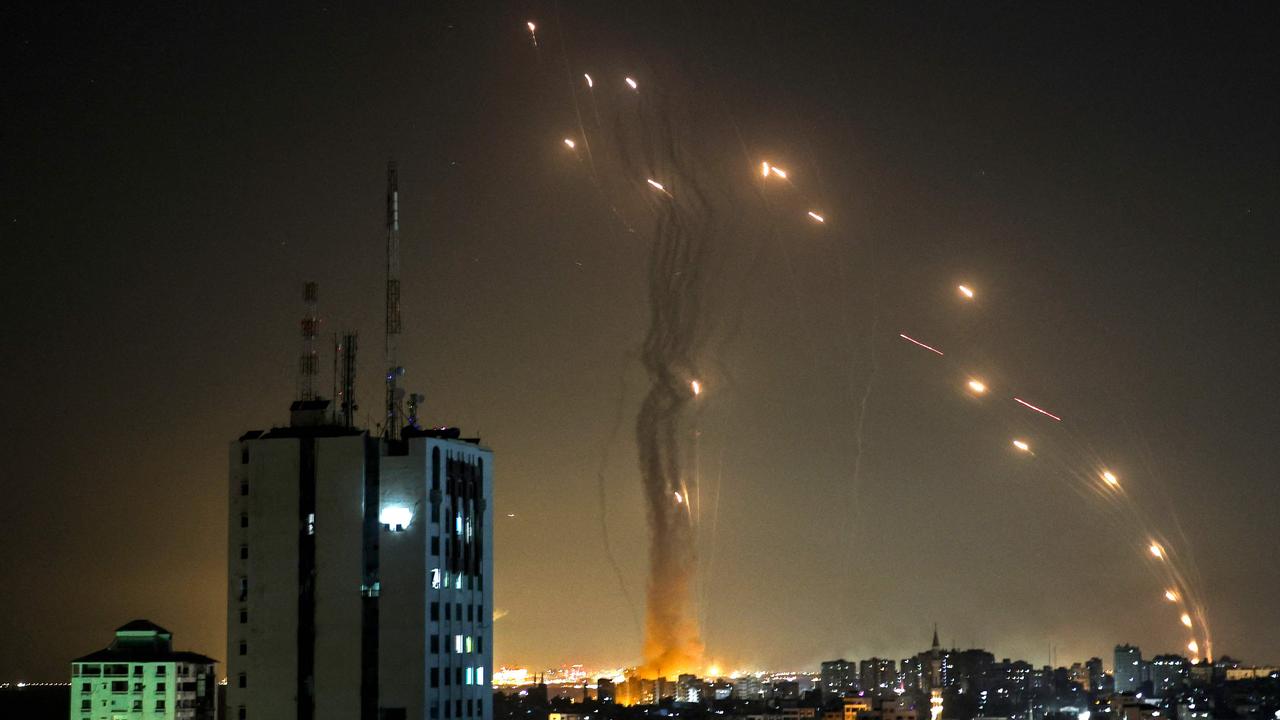 A rocket launched from Gaza city controlled by the Palestinian Hamas movement is intercepted by Israel's Iron Dome aerial defence system, on May 11. Picture: Mohammed Abed/AFP