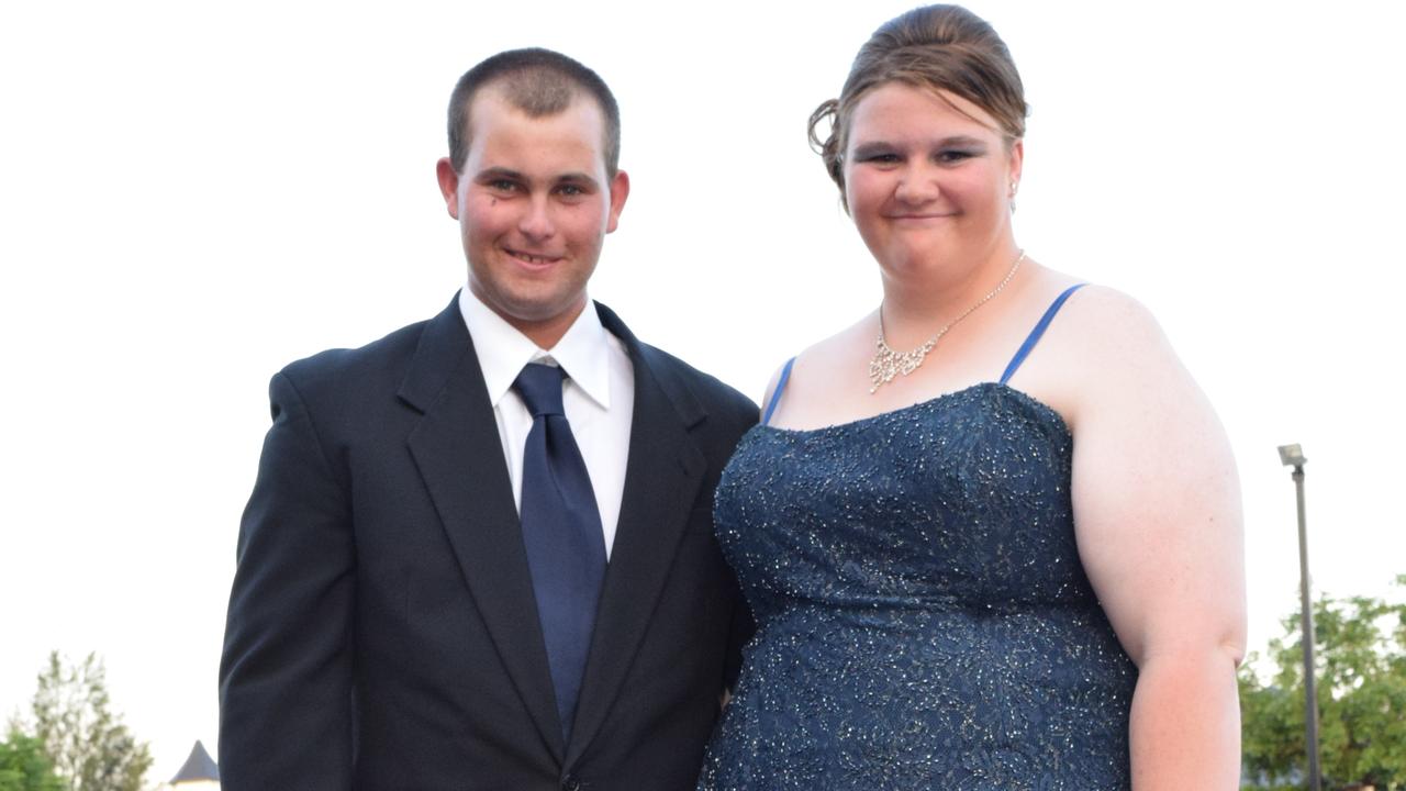 Gina Kerr and Touri Comerford pose for the cameras at the Roma State College formal. Photo Tom Gillespie / The Western Star