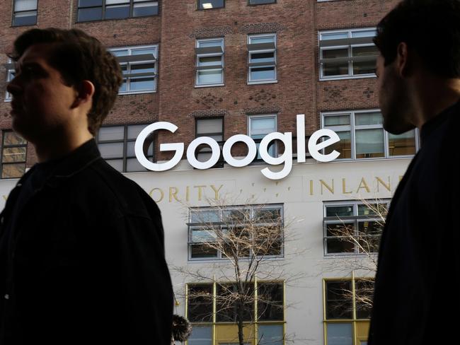 People walk by Google offices in New York. The company’s power could soon expand into hospitals. Picture: Mark Lennihan