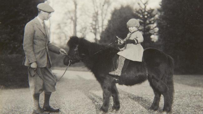 In May 1930, Princess Elizabeth’s mother took this shot of the youngster looking confident on a Shetland pony led by her father, the then Duke of York.