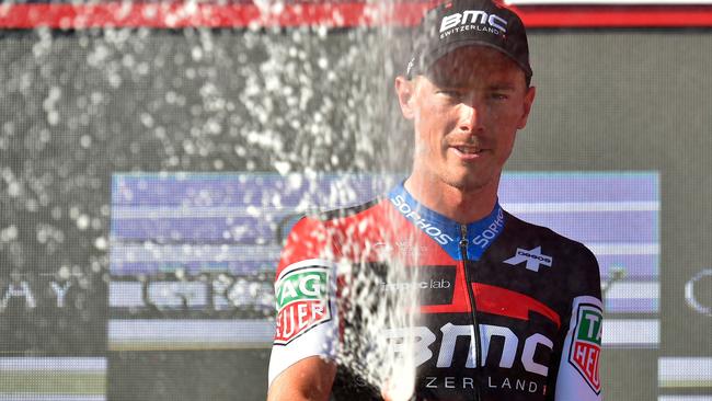 BMC Racing Team's Australian cyclist Rohan Dennis celebrates after winning the 16th stage of the 73rd edition of "La Vuelta" Tour of Spain cycling race, a 32 km individual time-trial from Santillana del Mar to Torrelavega, on September 11, 2018. (Photo by ANDER GILLENEA / AFP)