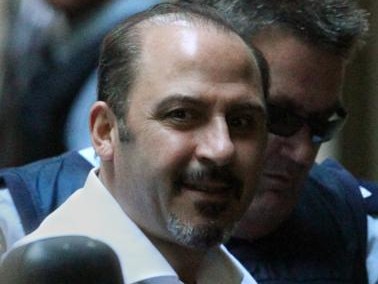 24/11/2011 NEWS: Supreme Court. Tony Mokbel looks up with a grin as he arrives alone in a prison van (with support van with armed guards one with a shotgun, standing by as he was unloaded)