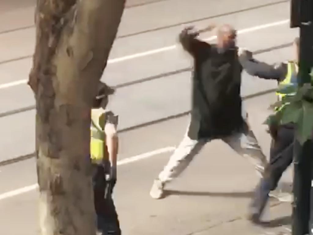 Hassan Khalif Shire Ali in the moments before he was shot by police after going on a stabbing rampage in Bourke St.