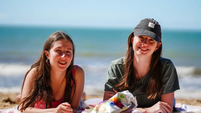 Georgia Glasson and Rachel Cavallaro soak up the winter sun at Trinity Beach. Picture: Nuno Avendano