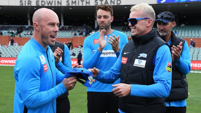 Chris Lynn receives his Strikers cap from Peter Siddle. Picture: Mark Brake/Getty Images