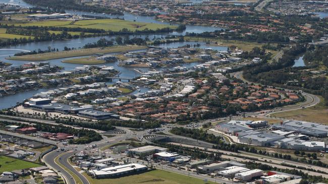 An aerial view of the planned Pacific Village commercial hub at Oxenford. The 1ha property is held by Global Properties (Australia). Supplied by Global Properties. Email: adam@globalproperties.com.au. Reporter: Travis Lye.