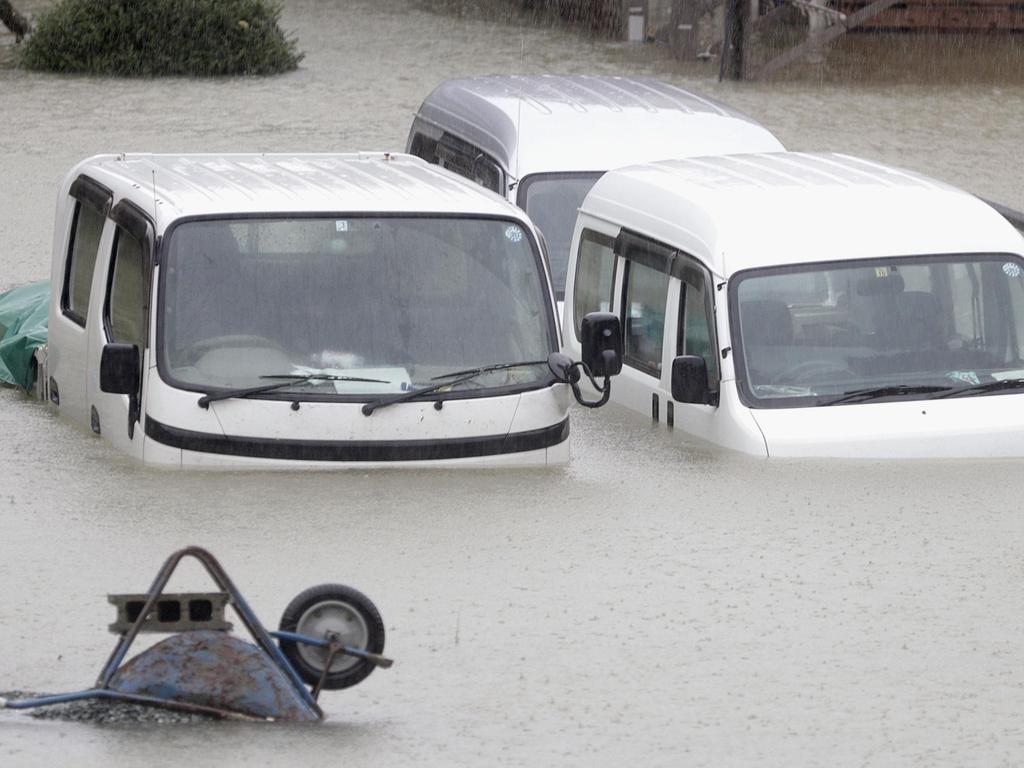 Cars sit submerged in water in central Japan. Picture: AP