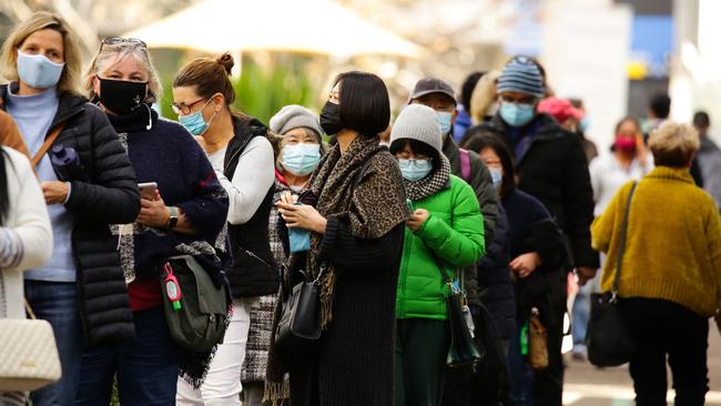 People queue for the vaccine at the hub at Sydney Olympic Park. Picture: Gaye Gerard.