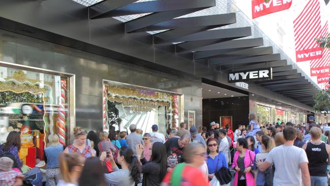 Shoppers out the front of the Myer Christmas windows in Bourke Street Mall during the festive period in 2013. Picture: iStock.