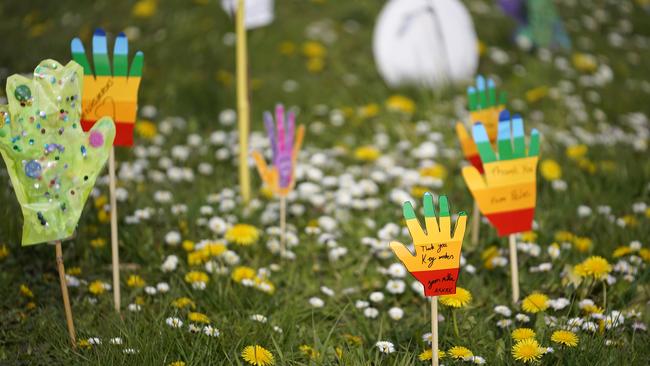 Rainbow coloured hands made by local children, in support of British health workers. Picture: Getty Images.