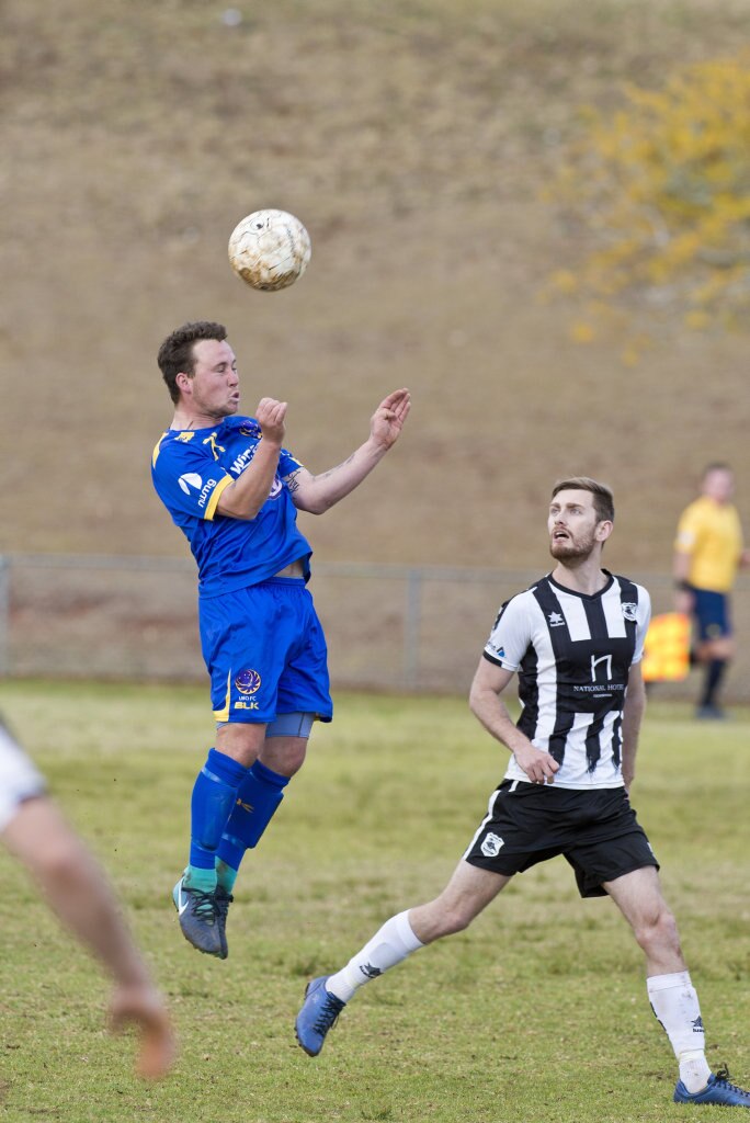 Ashley Freier (left) of USQ FC and Brayden Thrupp of Willowburn in Toowoomba Football League Premier Men semi-final at Commonwealth Oval, Sunday, August 26, 2018. Picture: Kevin Farmer