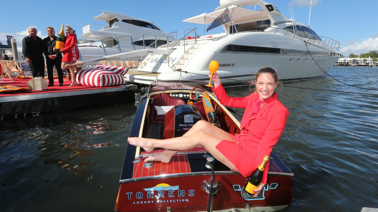 Katie Joyce (front) with Mitchell Grant Torrens, Grant Torrens and Sarah Morley of Torrens Luxury Collection celebrate the Sanctuary Cove International Boat Show. Picture: Mike Batterham