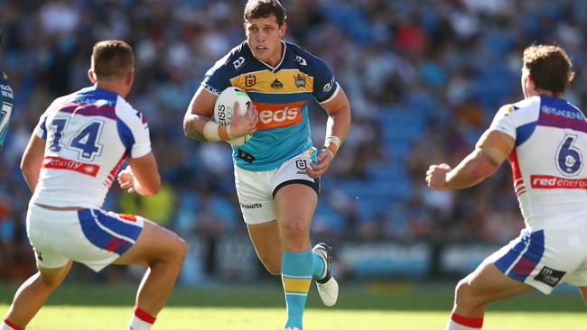 GOLD COAST, AUSTRALIA - APRIL 10: Jarrod Wallace of the Titans runs the ball during the round five NRL match between the Gold Coast Titans and the Newcastle Knights at Cbus Super Stadium, on April 10, 2021, in Gold Coast, Australia. (Photo by Chris Hyde/Getty Images)