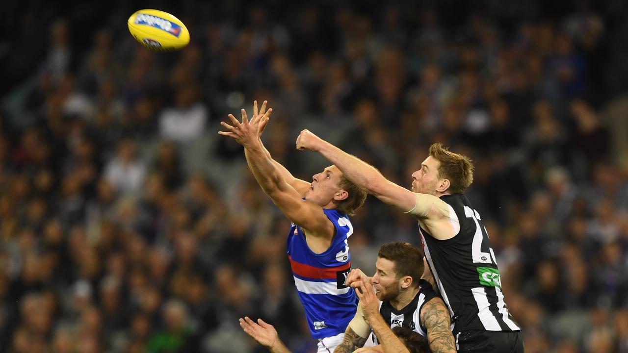 Jordan Roughead spoils Aaron Naughton at the MCG on Friday night.