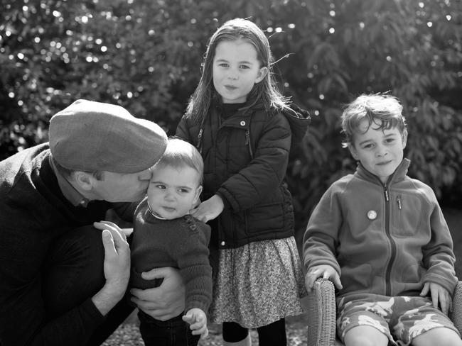 Prince William kisses Prince Louis as they pose next to Princess Charlotte and Prince George in Norfolk. Picture: The Duchess of Cambridge/Kensington Palace/Getty Images