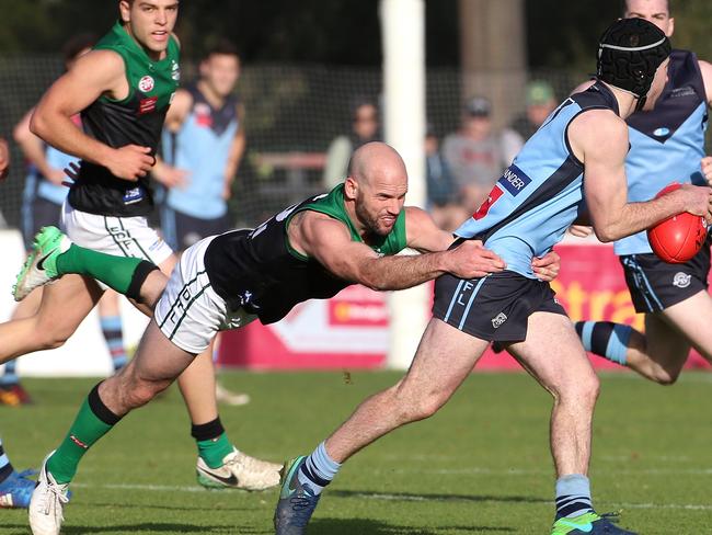 Zach Hislop of Aberfeldie is tackled by Paul Chapman of Greenvale. Picture: Hamish Blair