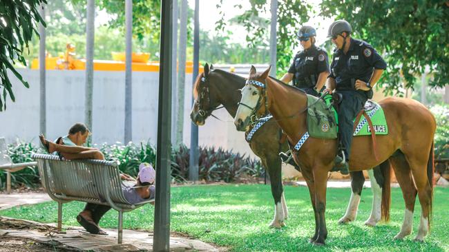 Senior Constable Erin Simonato (L) on Sabre and Senior Constable Charles Drury on Faceman on the streets of Darwin.