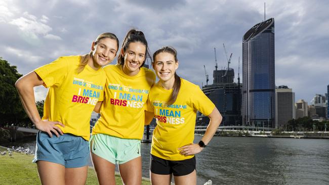 Queensland Firebirds netball players Kim Ravaillion, Emily Moore and Macy Gardner at South Bank to promote the 2023 Bridge to Brisbane. Picture: Richard Walker