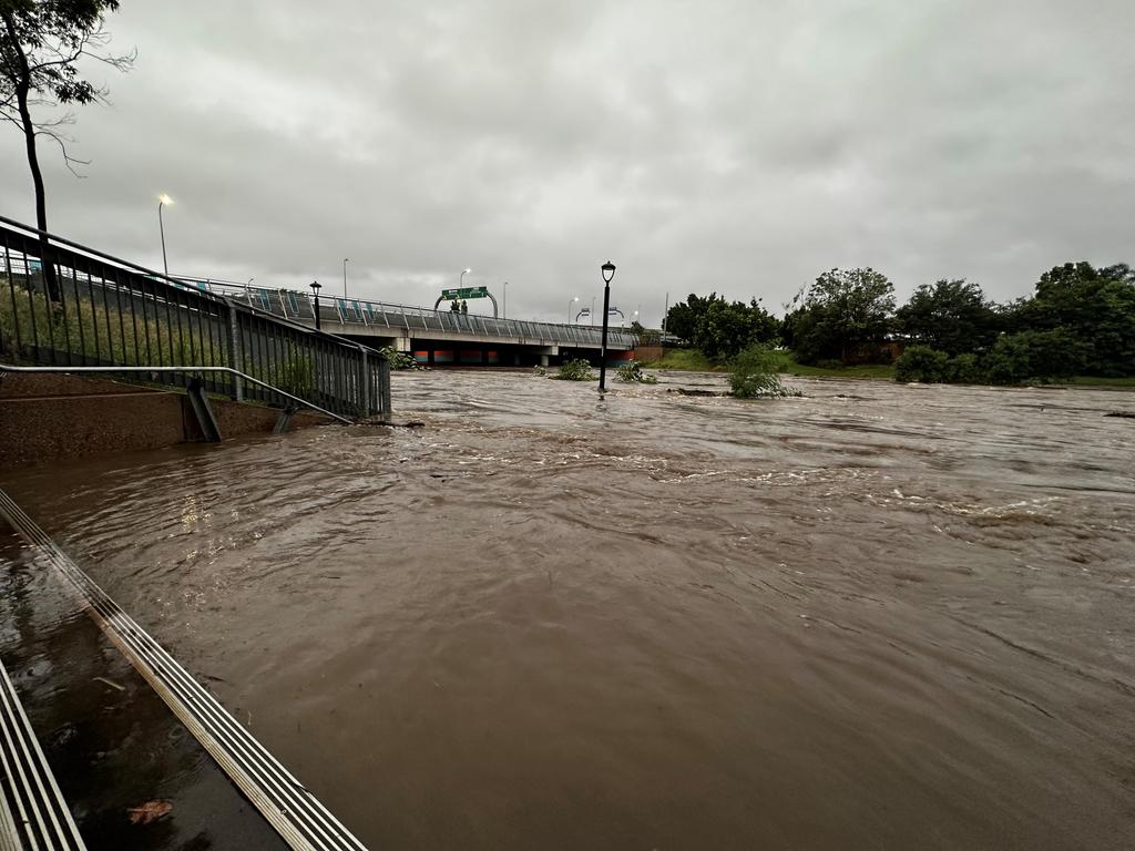 Kedron Brook has flooded close to Lutwyche Rd. Picture: QAS