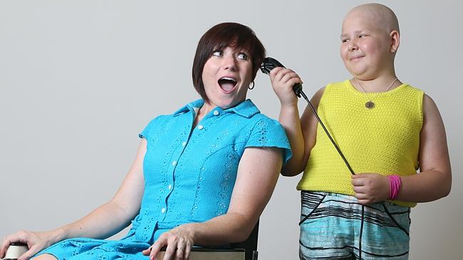 Cycling champion Anna Meares is going to shave her head for Little Heroes Foundation. Jessica, 11, is quite willing to do the job. Picture: Tait Schmaal. 