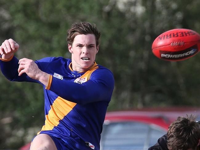 Bradley Lowe of Lilydale kicks under pressure from Jackson Glossop of Mitcham during EFL (Div 2): Lilydale v Mitcham on Saturday, July 7, 2018, in Lilydale, Victoria, Australia. Picture: Hamish Blair