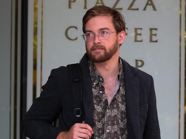 SYDNEY, AUSTRALIA : Newswire Photos - JANUARY 13 2025; Zack Schofield A climate activist is seen leaving the Downing Court in Sydney. The activist after he presented himself to Police after graffitiing the word Liar onto Tanya Pliberseks office. Picture: Newswire/ Gaye Gerard