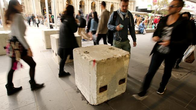 Going soon: concrete bollards were put in place across Melbourne’s CBD to protect pedestrians. Picture: Stuart McEvoy