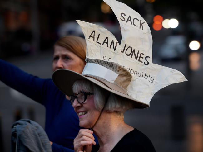 A protester wearing a ‘Sack Alan Jones’ Opera House hat walks to the protest. Picture: Tracey Nearmy