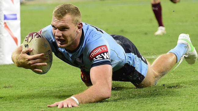 Tom Trbojevic crosses for one of his three tries against Queensland in Townsville Picture: Getty Images