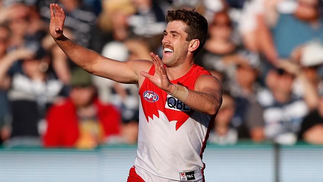 Robbie Fox celebrates a goal against Geelong.