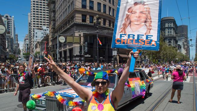 A supporter holds up a sign advocating the release of WikiLeaks whistle blower Chelsea Manning in a Gay Pride parade in San Francisco in 2016.