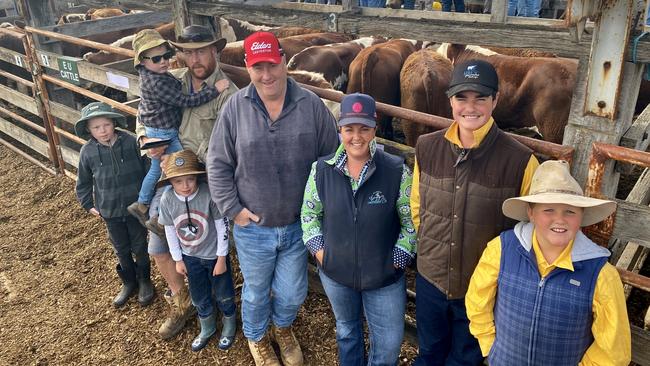 Charlie, Flynn and Austin Koch, with sellers Stephen and Jason Koch, Rosebank, and stud breeders from Wilkah Herefords, Ange Lyons and William and Albert Allison. Picture: Kate Dowler