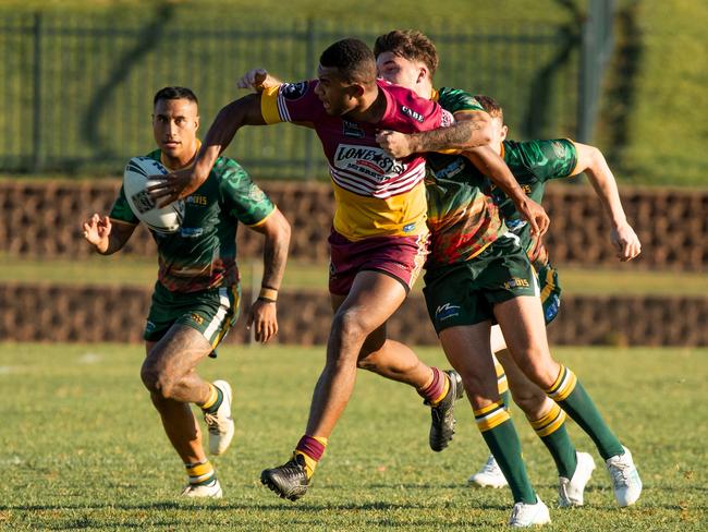 Kenneth Koro gets the ball away for Glenmore Park. Picture: Panthers Juniors