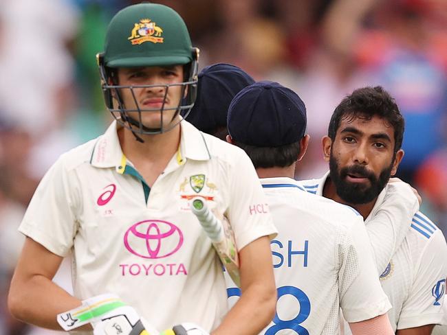 SYDNEY, AUSTRALIA - JANUARY 03: Jasprit Bumrah of India celebrates the wicket of Usman Khawaja of Australia as Sam Konstas of Australia walks away from the pitch during day one of the Fifth Men's Test Match in the series between Australia and India at Sydney Cricket Ground on January 03, 2025 in Sydney, Australia. (Photo by Morgan Hancock - CA/Cricket Australia via Getty Images)