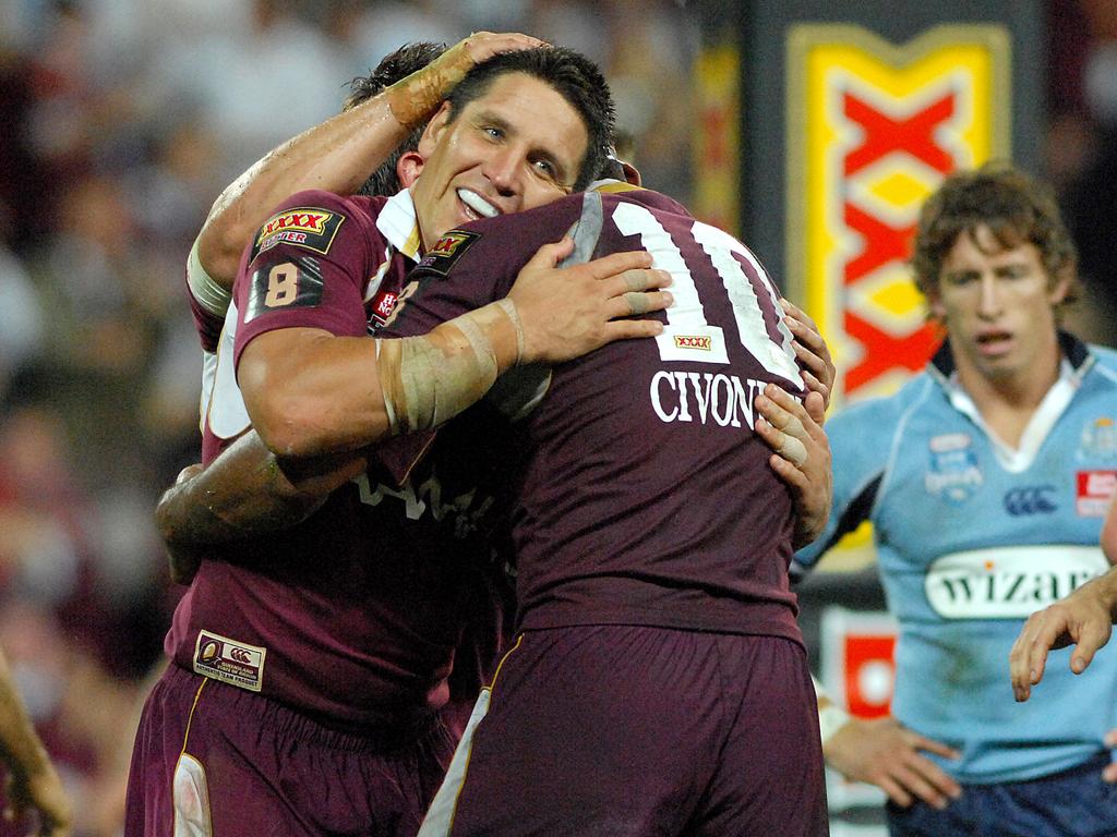 Queensland try scorer Steven Price is congratulated by teammates.